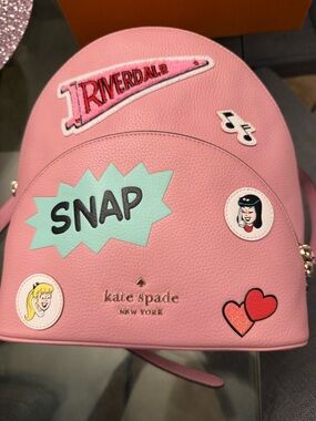kate spade pink Riverdale backpack with mint SNAP patch and playful decals